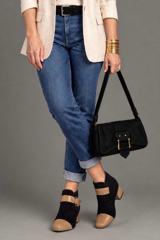 Women's camel and pitch black front-buckle ankle boots with round toe and low flared heel - Worn view